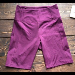 Girlfriend Collective bike shorts, medium in plum